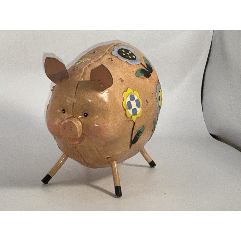 Floral Decorated Pig With Curly Tail And Cute Ears Made Of Metal?